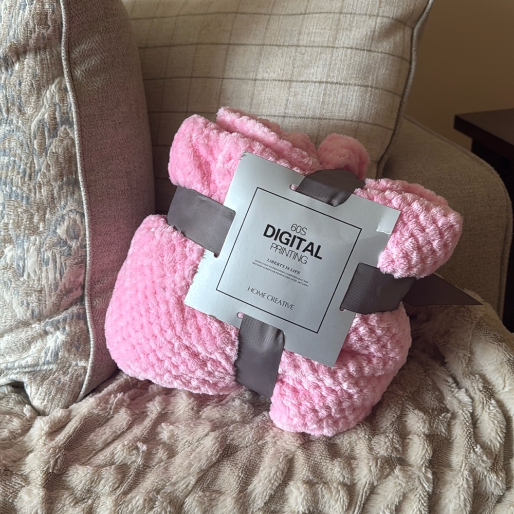Pink fluffy throw on blanket or baby blanket
